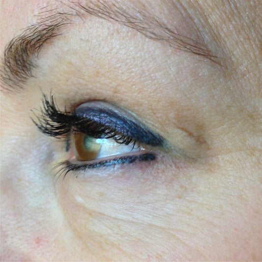 Blue-toned permanent eyeliner before color correction using Aqua Yellow Olive Mode pigment.