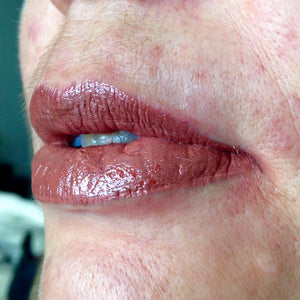 Close-up of healed permanent lip blush results using Aqua Pink mixed with Cinnamon Toast pigment, showing a soft warm nude lip tone after PMU lip pigmentation treatment.