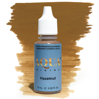 Product photo of Aqua Original Hazelnut pigment bottle with a warm brown brushstroke background. A medium, neutral-brown pigment perfect for brows and eyeliner procedures. Part of the Aqua Original pigment line by Girlz Ink, known for its smooth saturation and natural-healed results