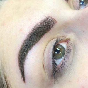 Combo brow permanent makeup result showing realistic hairstrokes and soft shading