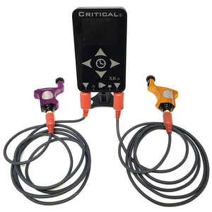 Critical XR-D Power Supply – dual input and dual output digital power unit for PMU and tattoo machines. Shown powering two devices simultaneously with precision voltage control and full-color digital display.
