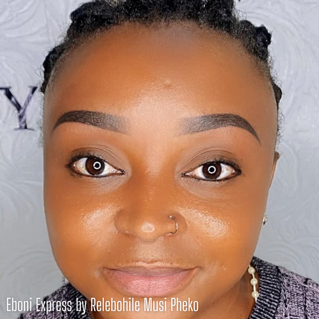 Close-up of a client with freshly done bold, defined brows using Eboni Express from the Li Pigments Aqua collection by artist Relebohile Musi Pheko. The pigment delivers a deep, cool brown-black tone ideal for rich, even healed results on deeper skin tones.