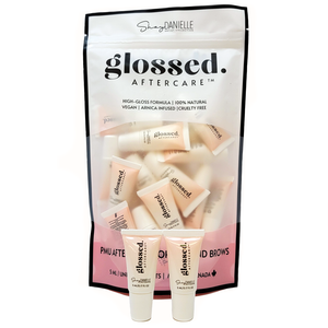 Glossed Aftercare mini lip balm tubes packaged for permanent makeup lip aftercare.