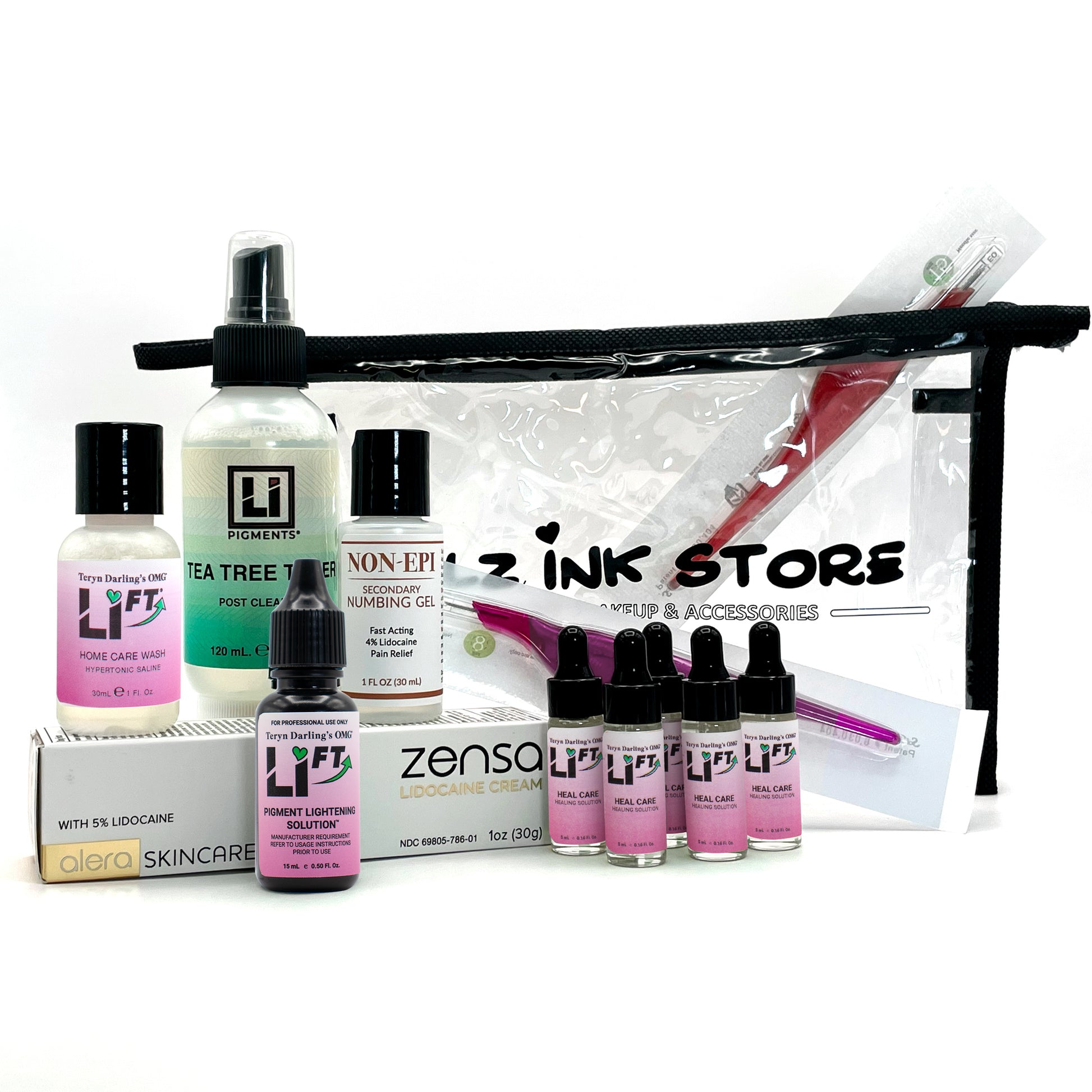 Flat lay of the Li-FT Saline Removal Starter Kit including Li-FT bottles, Non-Epi numbing solution, Tea Tree Toner, Zensa cream, and Girlz Ink Store clear travel bag, displayed on a white background for PMU artists performing safe tattoo lightening and removal.