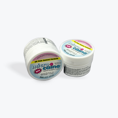 Two small containers of Microcaine topical anesthetic, with labels showing the product name and purpose.