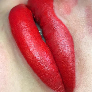 Freshly applied PMU lip blush using Li Pigments Aqua Global Red Hot lip pigment, showing bold red saturation and defined lip shape immediately after permanent makeup treatment by Bryony Fay Parry.