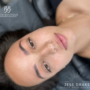 Client showcasing freshly done brows created with Rich Brown pigment from the Li Pigments Aqua collection. Work by Jess Drake of Brow Boutique, featuring balanced, natural-toned brows ideal for medium to deep skin tones and brunettes.