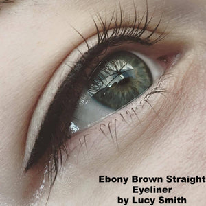 Close-up of eyeliner tattoo done with Aqua Ebony Brown on a client with green eyes, by Lucy Smith.