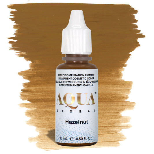 Aqua Global Hazelnut hybrid PMU brow pigment in a warm medium brown shade, ideal for clients with soft golden undertones on Fitzpatrick 2–4 who prefer a natural warm-brown healed result.