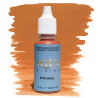 Aqua UN-Grey PMU pigment bottle with orange swatch – warm orange-based correction pigment formulated to neutralize ashy, grey, or cool-toned eyebrows.