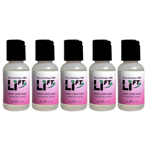Five bottles of Teryn Darling’s OMG Li-FT Home Care Wash Hypertonic Saline, used for PMU and tattoo lightening aftercare, displayed on a white background.