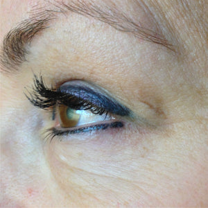 Blue-toned permanent eyeliner before color correction using Aqua Yellow Olive Mode pigment.