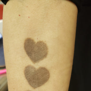 Two healed swatches of Loaded Rawhide pigment on skin for permanent makeup pigment reference.