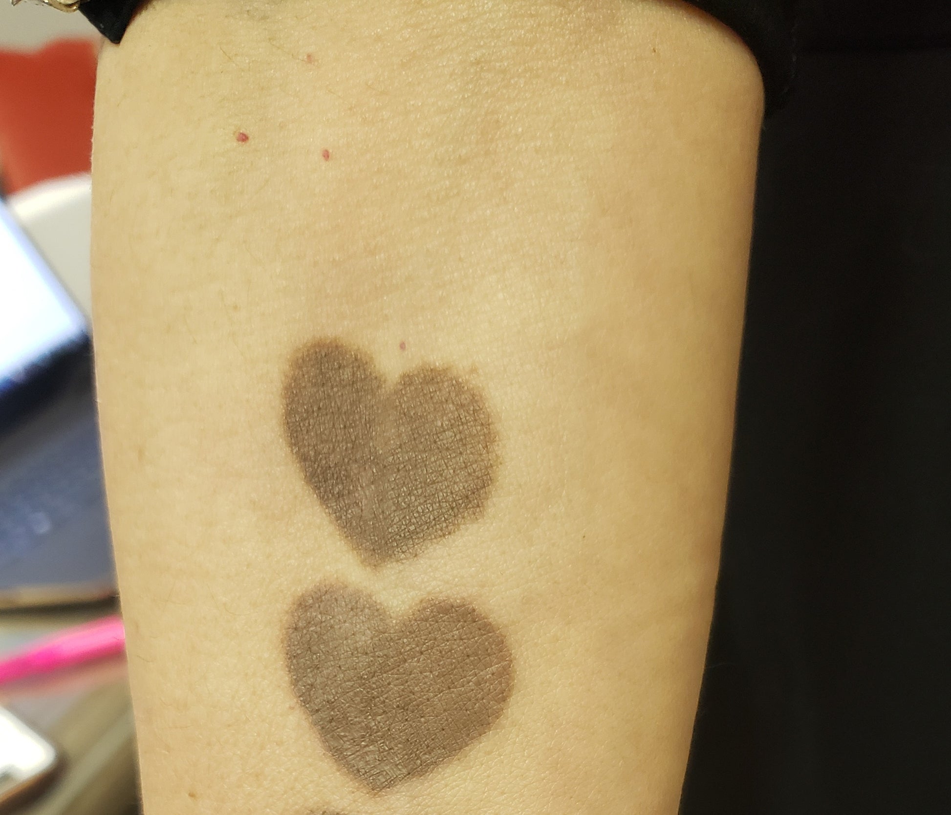 Two healed swatches of Loaded Rawhide pigment on skin for permanent makeup pigment reference.