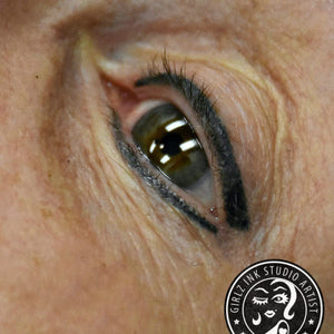 Healed PMU eyeliner using Onyx with a hint of Charcoal pigment for a soft, deep black effect on mature skin by Teryn Darling.