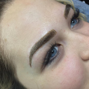 Healed powder brows created by Shawnna Wilson using Aqua Chocolate Truffle pigment for a soft, dimensional brunette result on fair skin.