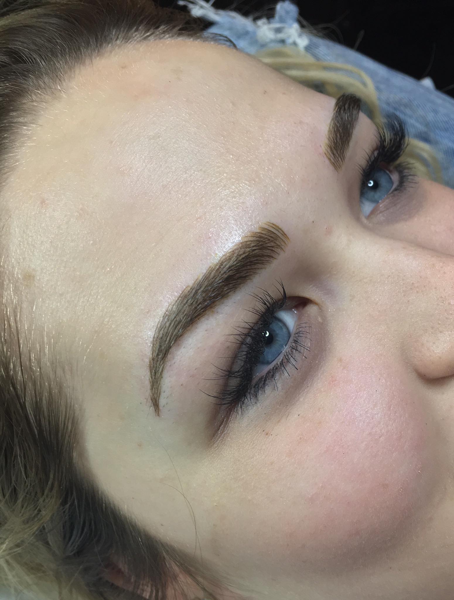 Healed powder brows created by Shawnna Wilson using Aqua Chocolate Truffle pigment for a soft, dimensional brunette result on fair skin.