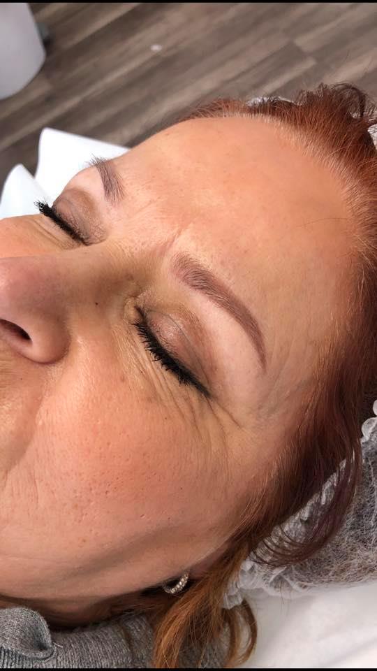 Healed permanent makeup brows six months after using Li Pigments Aqua Auburn pigment by artist Lizabeth Su, showing natural warm-toned results on fair skin.