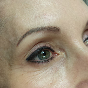 Permanent eyeliner created using Li Pigments Aqua Global Midnight Black, healed after one and a half years. Applied by Teryn Darling of Girlz Ink, showing a rich black lash line with smooth retention and natural fading.