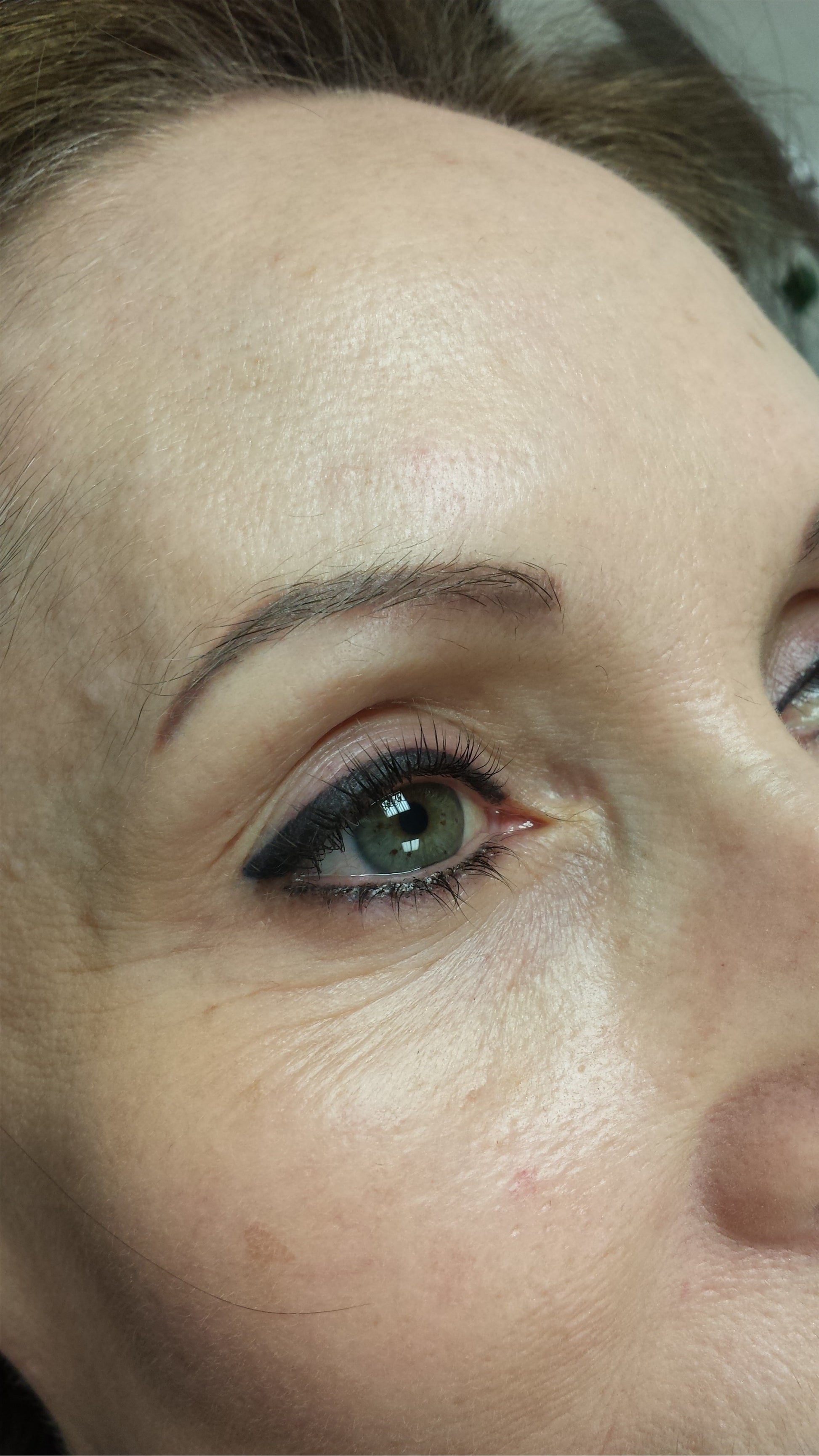 Permanent eyeliner created using Li Pigments Aqua Global Midnight Black, healed after one and a half years. Applied by Teryn Darling of Girlz Ink, showing a rich black lash line with smooth retention and natural fading.