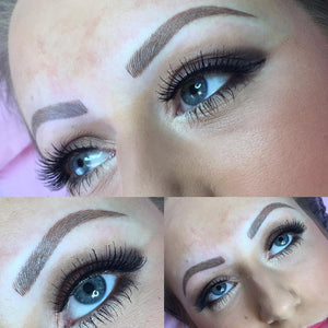 Healed powder brows created with Li Pigments Aqua Milk Chocolate by artist Julie Smitherman. Close-up of defined, medium-to-dark warm brown eyebrows showing soft, natural healed color and crisp hairstrokes.