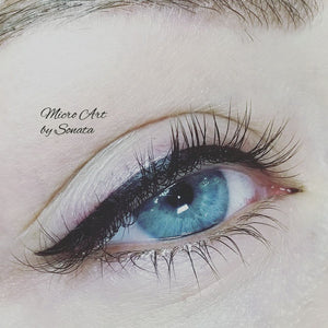Permanent eyeliner created using Li Pigments Black Diamond from the Aqua Line, applied by artist Sonata Simo of Micro Art by Sonata. The photo shows a crisp, dark lash line enhancement on a blue eye with soft shading.