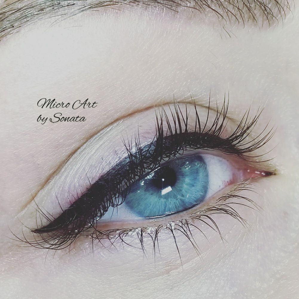 Permanent eyeliner created using Li Pigments Black Diamond from the Aqua Line, applied by artist Sonata Simo of Micro Art by Sonata. The photo shows a crisp, dark lash line enhancement on a blue eye with soft shading.