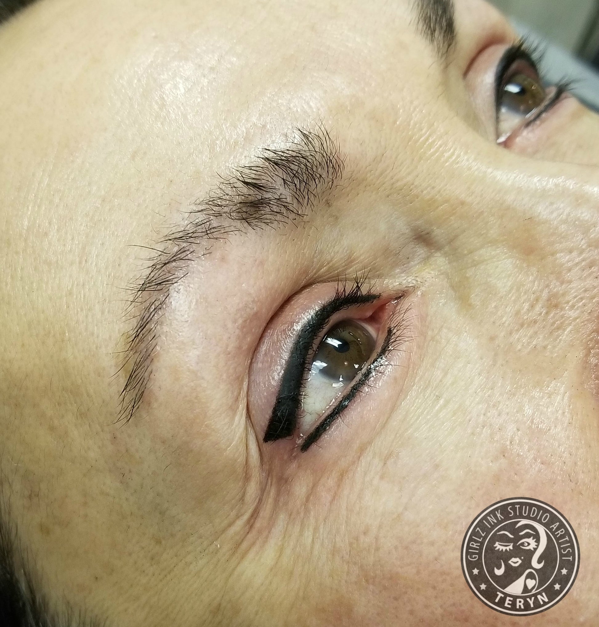Fresh permanent eyeliner created using Li Pigments Black Diamond from the Aqua Line by Teryn Darling of Girlz Ink, showing a crisp black winged line with rich color saturation and smooth healed skin.