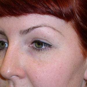 Healed permanent eyeliner on a red-haired client using Li Pigments Ultra Black from the Aqua Line, showing soft healed results and even color retention along the lash line.