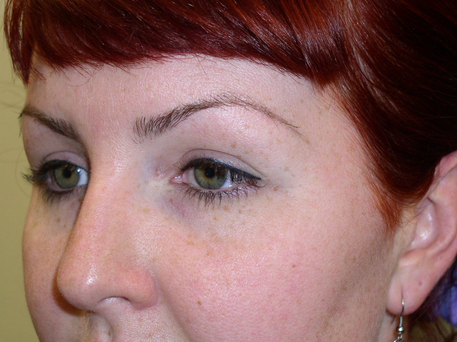 Healed permanent eyeliner on a red-haired client using Li Pigments Ultra Black from the Aqua Line, showing soft healed results and even color retention along the lash line.