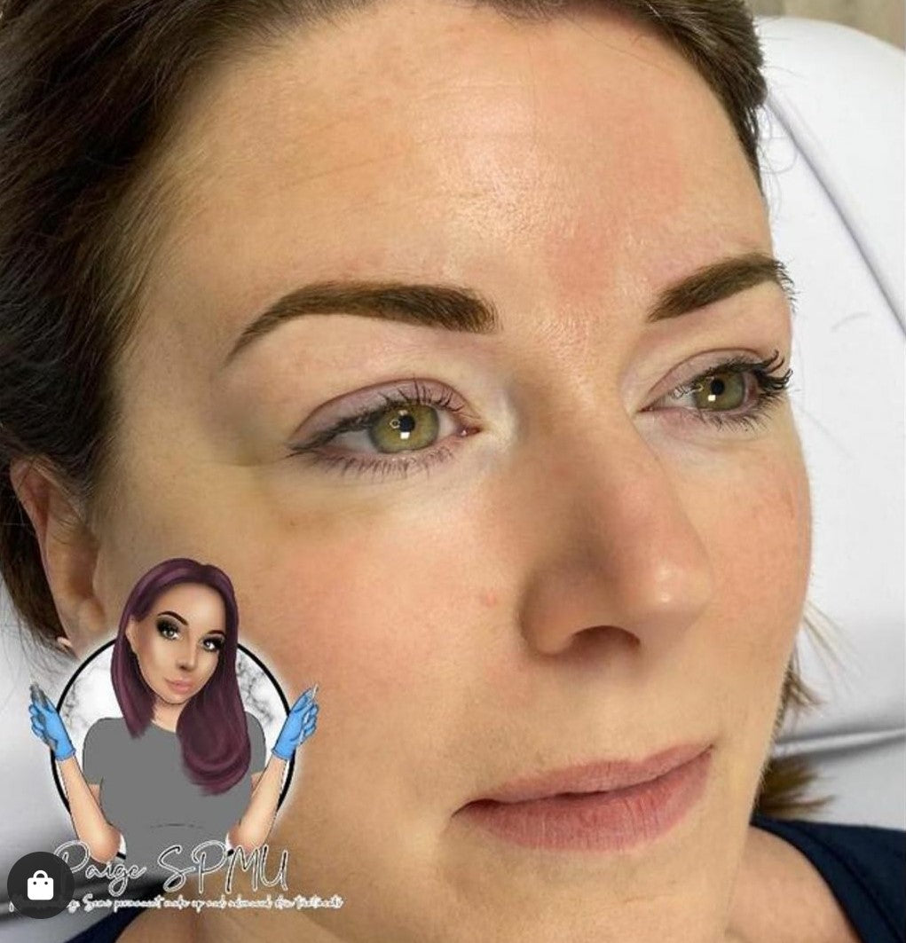 Healed brow results using a mix of Loaded Maverick and Smoke pigments on medium skin tone.