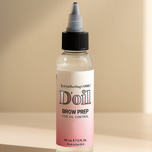 Clear and pink-labeled bottle of Teryn Darling’s OMG D’oil Brow Prep for PMU skin prep on a soft beige surface.