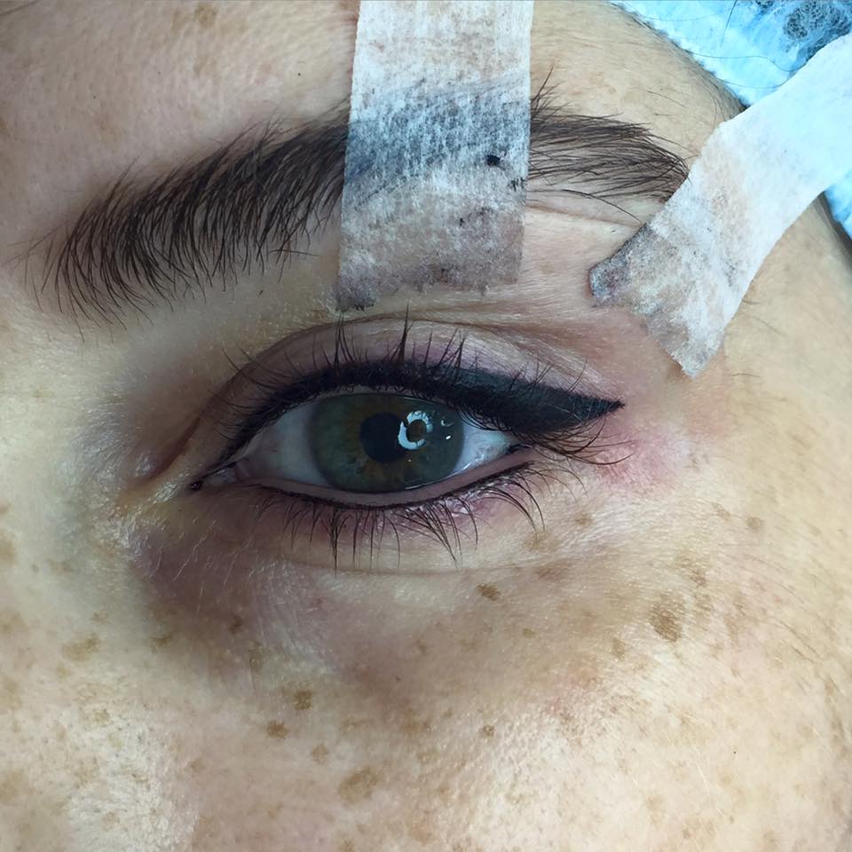 Permanent eyeliner tattoo using Aqua Onyx pigment by Nada El Hoss. Bold upper liner application in progress.