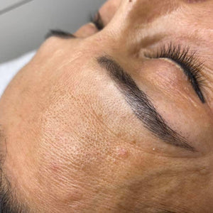 Custom PMU brow color mix using Cheatin’ Heart, Outlaw Brown, and Whiskey Brown pigments by Melanie KT, showcasing warm brown healed results.