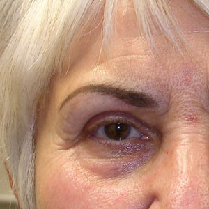 Healed brow color correction using Taupe and Charcoal pigment blend for a natural, cool-toned finish.