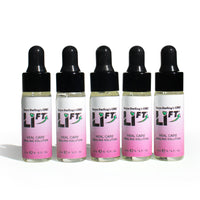 Five bottles of Teryn Darling’s OMG Li-FT Heal Care Healing Solution 5mL, designed for PMU and tattoo lightening aftercare, displayed on a white background.