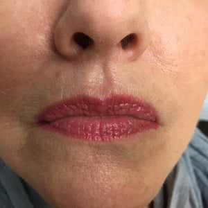 Freshly tattooed lips using Watermelon Lip Candy pigment by Robin Hays, showing a vibrant, juicy pink-toned lip color.