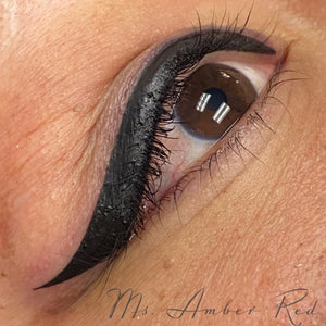 Winged eyeliner permanent makeup done with Aqua Onyx pigment by Amber Guthery. Rich, black healed result.