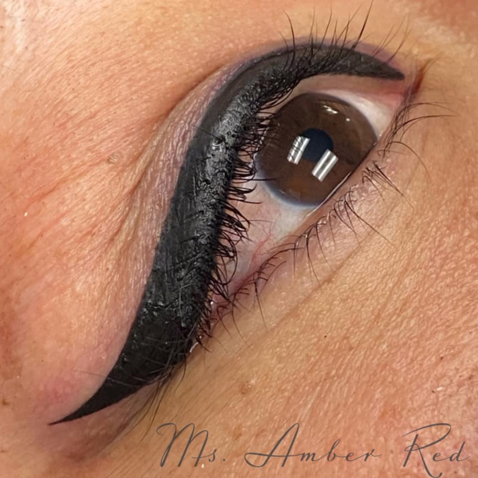 Winged eyeliner permanent makeup done with Aqua Onyx pigment by Amber Guthery. Rich, black healed result.